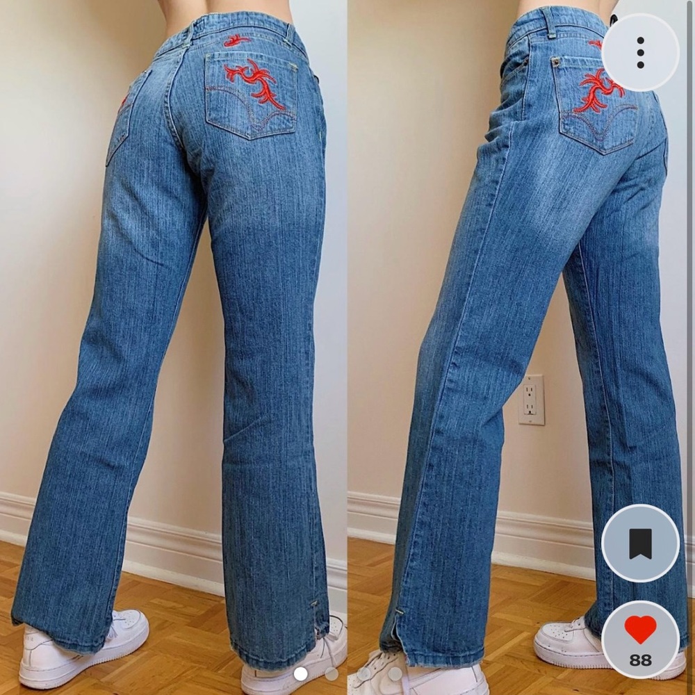 Mid-raise blue flare jeans with red embroidery on back pockets